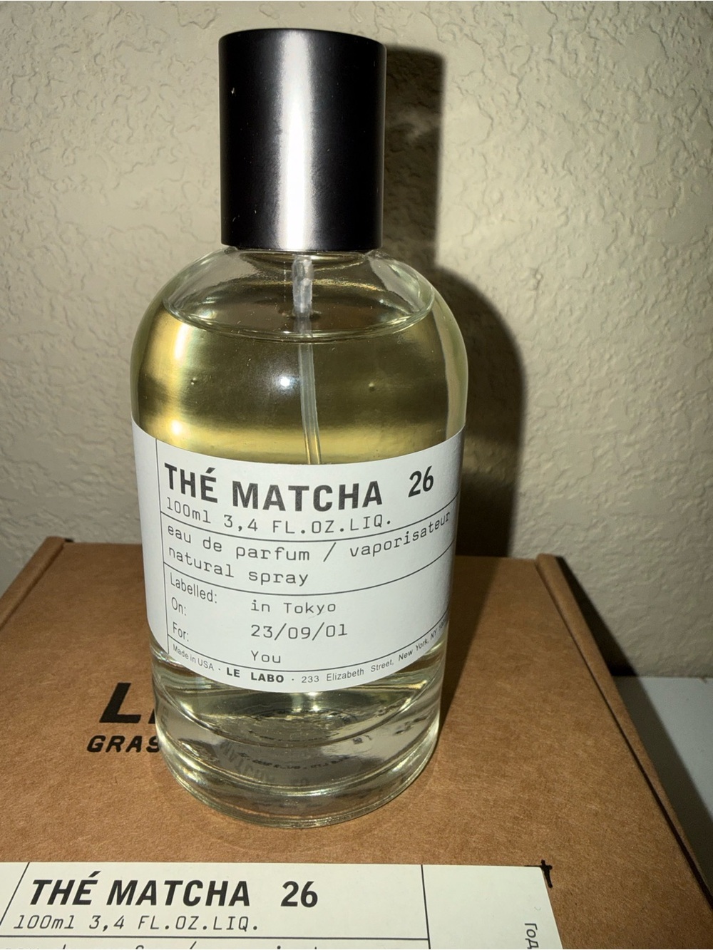 Le Labo Thé Matcha 26 Bottle with Silver Cap and Light Yellow Liquid